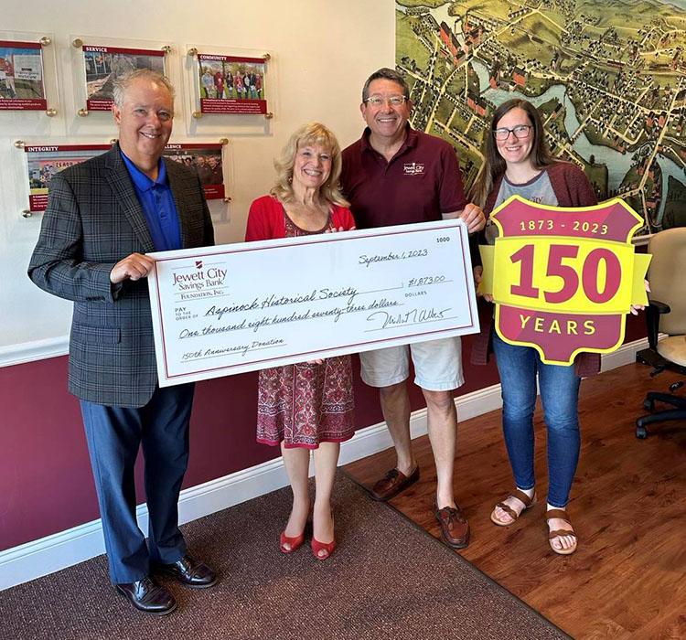 Aspinock Historical Society accepting the donation check.